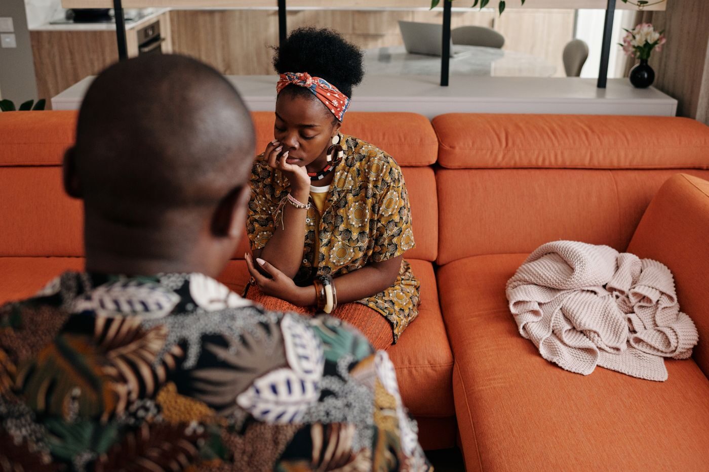 A couple sitting together in a difficult conversation
